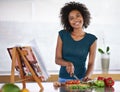 Cooking, portrait and happy woman chopping vegetables with recipe book in kitchen for healthy diet, nutrition or lunch Royalty Free Stock Photo