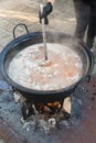 Cooking pot over campfire, stew preparing open grill steaming. Outdoor fireplace camping concept Royalty Free Stock Photo