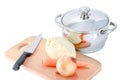 Cooking pot and vegetables on chopping board Royalty Free Stock Photo