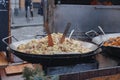 Cooking of potato dumplings with sheep cheese and bacon at Christmas market on the Cabbage Market Brno, Czech Republic Royalty Free Stock Photo