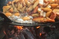 Cooking potatoes with eggs on an open fire Royalty Free Stock Photo