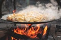 Cooking potatoes with eggs on an open fire Royalty Free Stock Photo