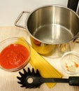 Cooking preparation for cooking spaghetti and tomato sauce