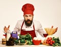 Cooking process concept. Man with beard looks at ingredients