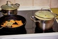 Frying chicken in a pan. Cooking potatoes Royalty Free Stock Photo