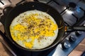 Cooking process of frying huge ostrich egg on frying pan Royalty Free Stock Photo