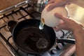 Cooking process of frying huge ostrich egg on frying pan
