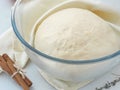 Cooking process. Leavened fresh dough in misted bowl. Preparing dough for cakes, pastries, buns or pizza.