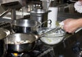 Cooking in a professional restaurant kitchen on the stove with f Royalty Free Stock Photo