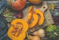 Cooking pumpkin.Halloween and Thanksgiving theme.Pumpkin. Autumn food background with cinnamon, nuts and seasonal spices Royalty Free Stock Photo