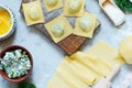 Cooking Raviolli homemade pasta with ricotta and spinach on a blue background, traditional Italian cuisine Royalty Free Stock Photo