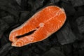 Cooking raw salmon fish steak on charcoal Royalty Free Stock Photo