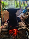 cooking rice on a stove and traditional tools Royalty Free Stock Photo