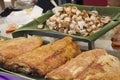 Cooking roasted crispy pork belly placed on a banana leaf