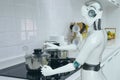 Cooking robot artificial intelligence to cook food in futuristic concept