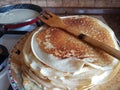 Cooking Russian thin pancakes, rosy roasted