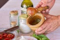 Cooking sauce using mortar and pestle Royalty Free Stock Photo