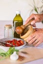 Cooking sauce using mortar and pestle Royalty Free Stock Photo