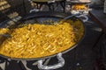 Cooking and serving a huge pan of Paella on the Burriana Beach in Nerja Andalucia Spain