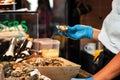 Cooking and serving seafood, chef opened an oyster shell in a fast food restaurant Royalty Free Stock Photo