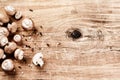 Cooking setting with fresh mushrooms on old wooden table Royalty Free Stock Photo