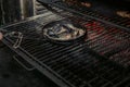 Cooking shrimps with oysters on a fried pan - on a stove with fire background Royalty Free Stock Photo