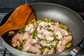 Cooking sliced onions, green peppers and chicken breasts Royalty Free Stock Photo