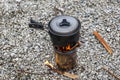 Cooking on a small camping stove in a mountain camp