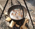 Cooking soup on campfire Royalty Free Stock Photo