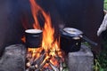 Cooking soup on campfire at garden in pan Royalty Free Stock Photo