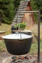 Cooking soup in a kettle on an open fire Royalty Free Stock Photo