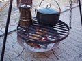 Cooking soup over burning campfire Royalty Free Stock Photo