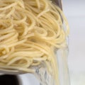 Cooking spaghetti noodles meal strain the pasta from hot water