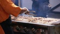 Cooking spicy kebabs at street fair