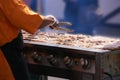 Cooking spicy kebabs at street fair