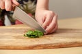 Cooking spinach leaves on a cutting Board in the kitchen Royalty Free Stock Photo