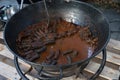 Cooking stew campfire concept, stew preparing open grill steaming Royalty Free Stock Photo