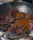 Cooking stew campfire concept, stew preparing open grill steaming Royalty Free Stock Photo