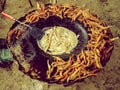 Cooking Street food Charales fritos being fried on a comal in a small village in Michoacan Mexico Royalty Free Stock Photo