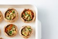 Cooking stuffed champignons in a baking dish. Close-up. Top view Royalty Free Stock Photo