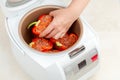 Cooking stuffed peppers in multicooker Royalty Free Stock Photo