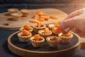 Cooking sweet tartlets with slices of tangerine and chocolate - unfolding tangerine slices