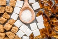 Cooking sweets set with sugar in spoons on kitchen table background top view pattern