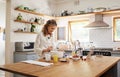 Cooking, tablet and senior woman with recipe for food on the internet while in the kitchen of her house. Happy elderly Royalty Free Stock Photo