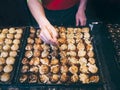 Cooking Takoyaki on hot pan Famous street food Osaka Japan