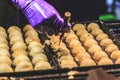 Cooking takoyaki most popular delicious snack of japan. Asian street food night market.