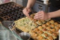 Cooking Takoyakis at a street stand in Osaka Royalty Free Stock Photo