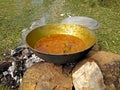 Cooking tasty delicious indian food item during a picnic or outdoor camp Royalty Free Stock Photo