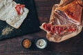 Cooking tasty panini with ham covered with cheese, tomatoes and flavoring Royalty Free Stock Photo