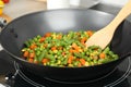 Cooking tasty vegetable mix in wok pan, closeup Royalty Free Stock Photo